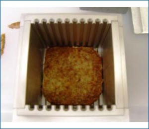 Ground meat sample within test cell