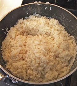 Rice cooking in wok